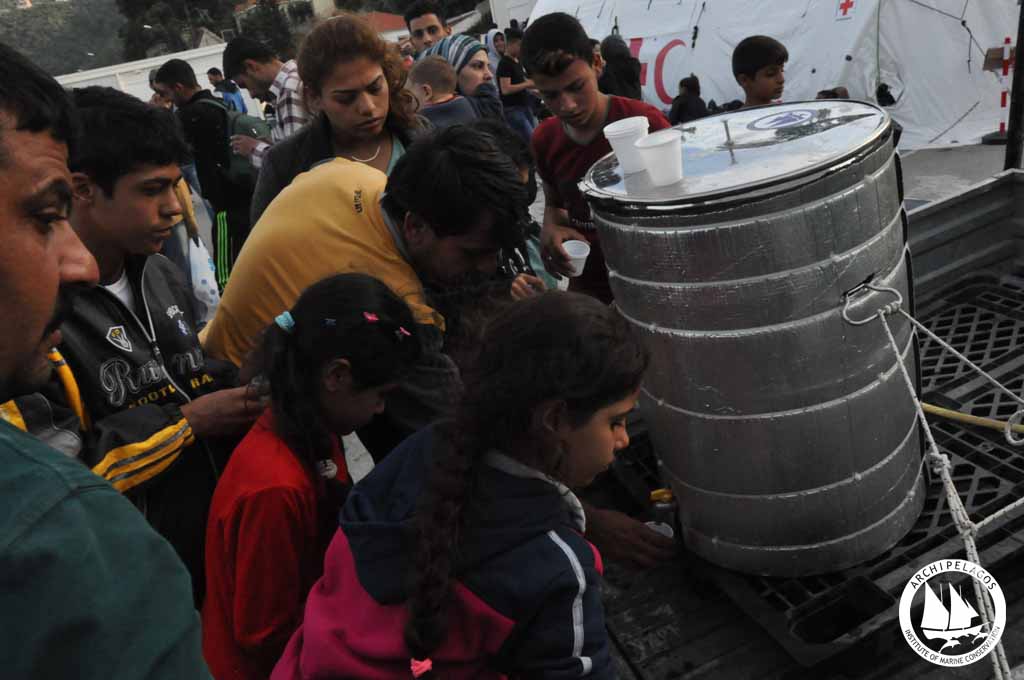 refugee kids drinking water
